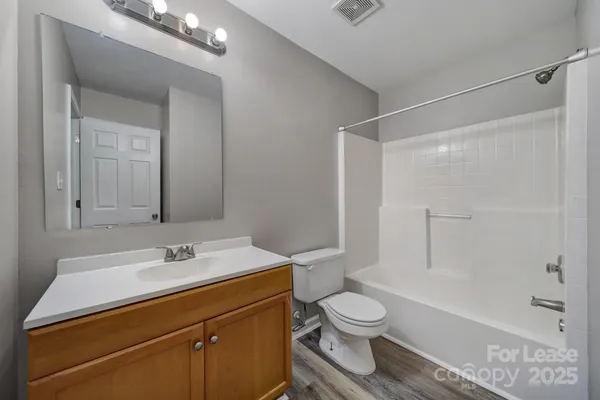 an empty room with closet area