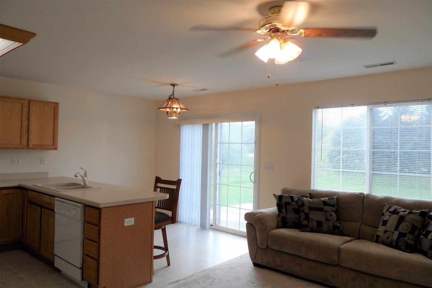 369 South Boo Road, Unit D Chesterton, IN 46304 - Photo 8 of 10 a living room with furniture and a chandelier