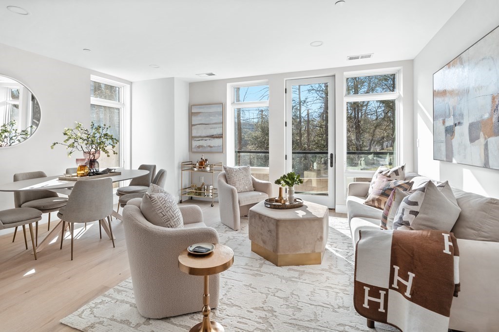 20 Kinmonth Road, Unit 106 Newton, MA 02468 - Photo 7 of 21 a living room with furniture and a large window