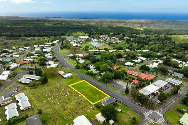 an aerial view of residential houses with outdoor space and swimming pool