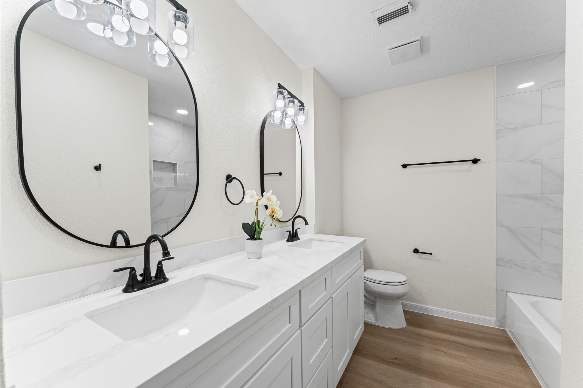2914 Riata Lane Houston, TX 77080 - Photo 26 of 39 a bathroom with a sink and a mirror