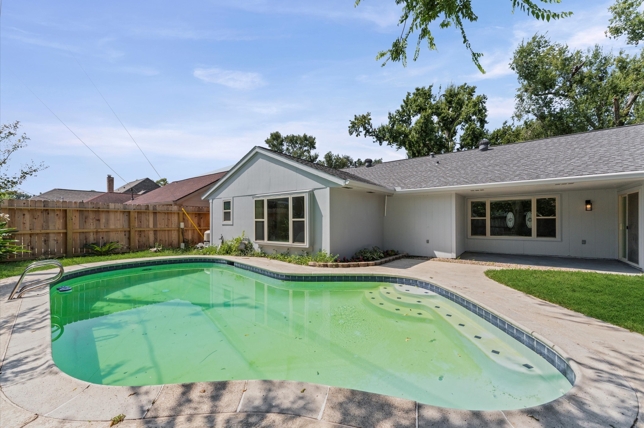 2914 Riata Lane Houston, TX 77080 - Photo 35 of 39 a view of a house with a swimming pool and a yard