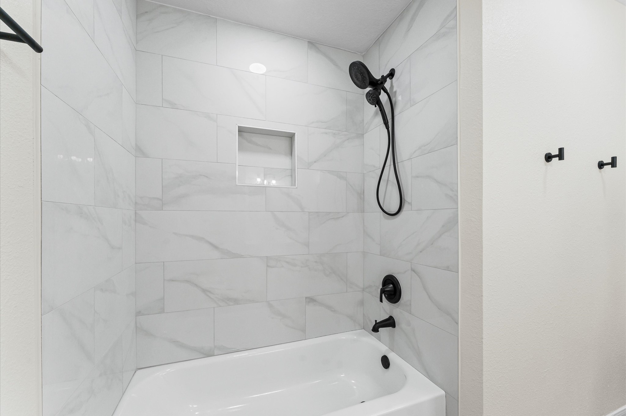 2914 Riata Lane Houston, TX 77080 - Photo 4 of 39 a bathroom with a bath tub with a shower