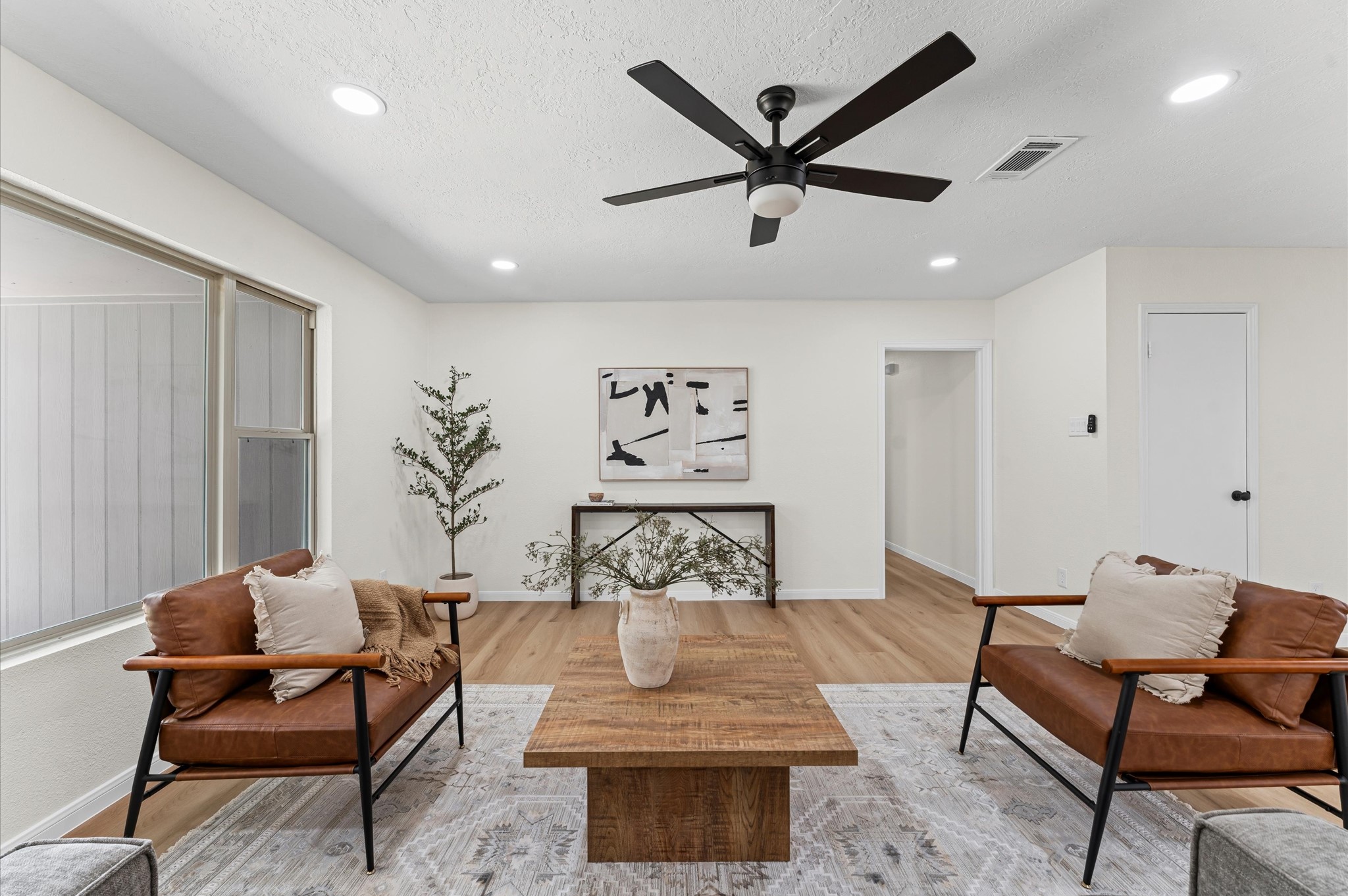 2914 Riata Lane Houston, TX 77080 - Photo 39 of 39 a living room with furniture and a ceiling fan