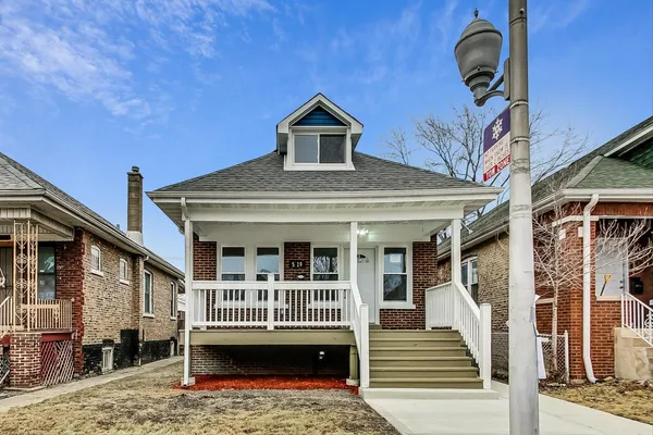 a front view of a house with a porch