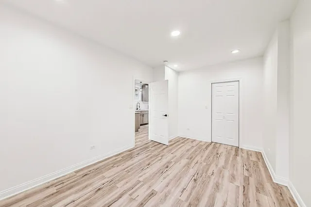 a view of hallway with wooden floor
