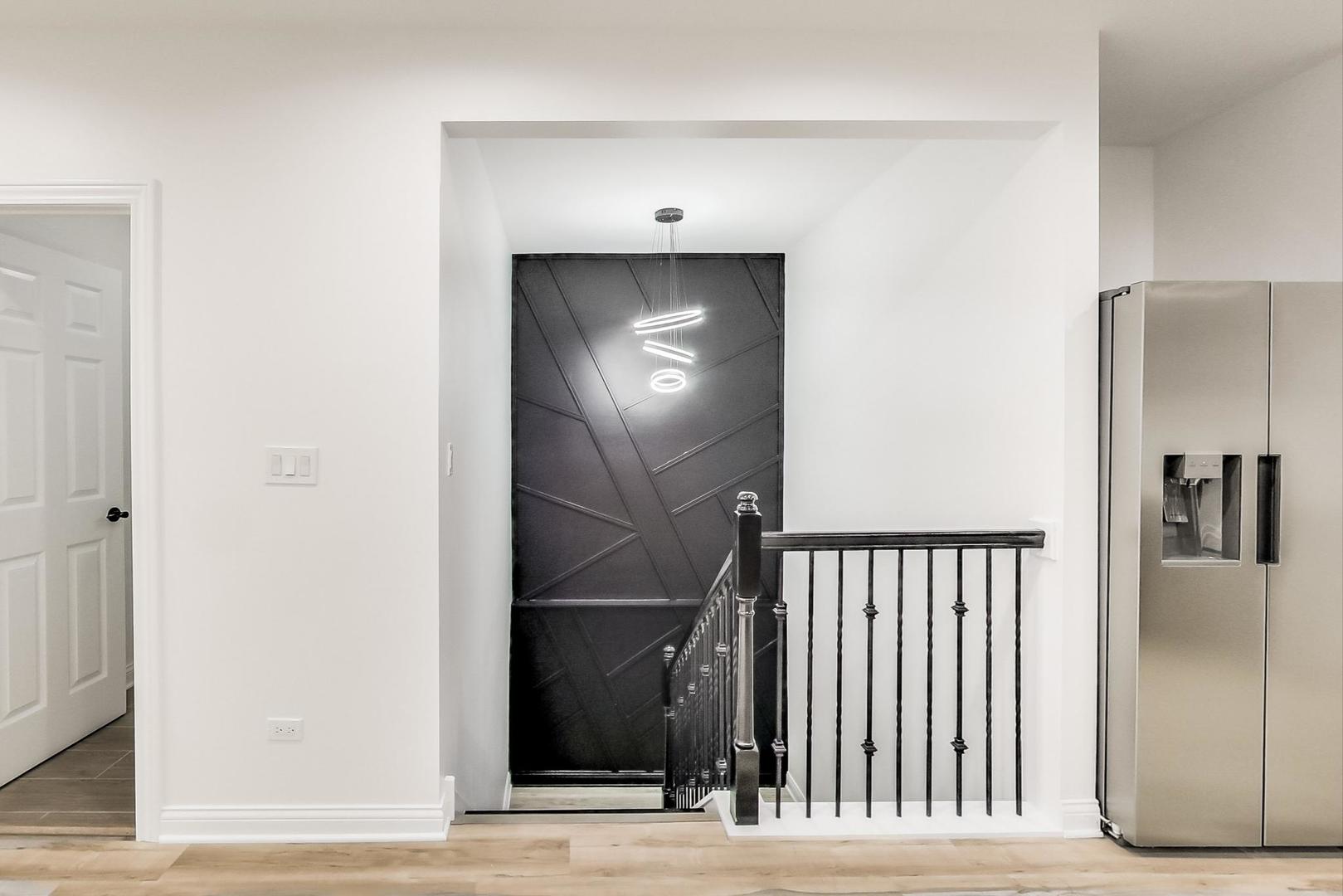 5619 South California Avenue Chicago, IL 60629 - Photo 16 of 31 a view of a hallway with wooden floor