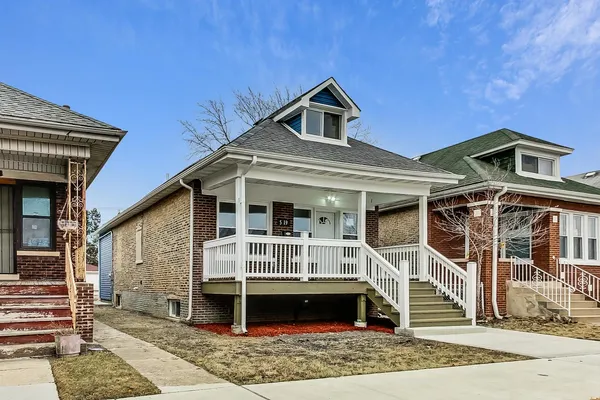 front view of a house with a small yard