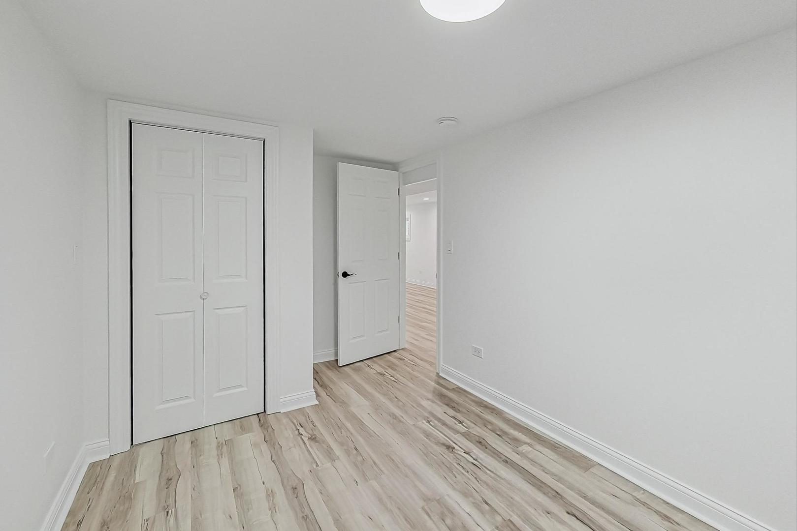 5619 South California Avenue Chicago, IL 60629 - Photo 21 of 31 a view of an empty room and wooden floor