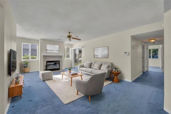 a living room with furniture and a fireplace