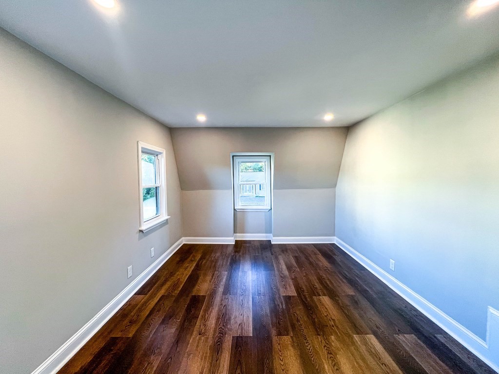 67 Waltham Street Maynard, MA 01754 - Photo 13 of 29 a view of empty room with window and wooden floor