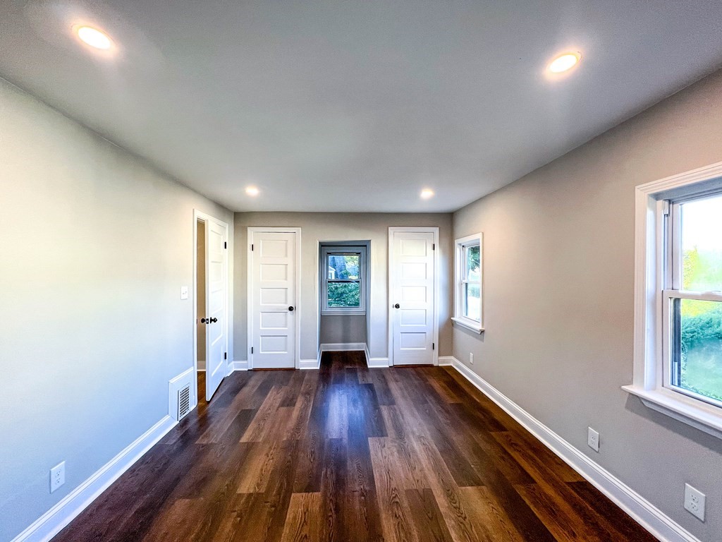 67 Waltham Street Maynard, MA 01754 - Photo 14 of 29 wooden floor in an empty room with a window