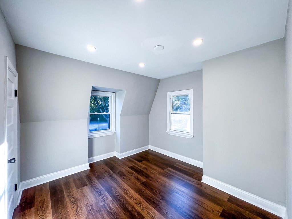 67 Waltham Street Maynard, MA 01754 - Photo 15 of 29 a view of empty room with wooden floor and fan