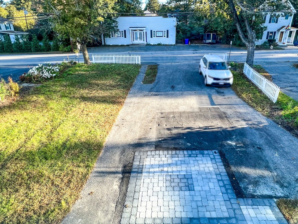 67 Waltham Street Maynard, MA 01754 - Photo 2 of 29 a view of a yard with an outdoor space