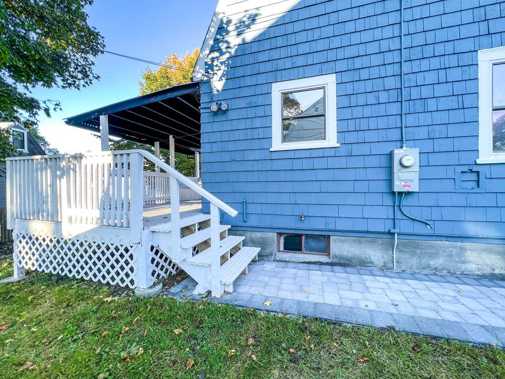 67 Waltham Street Maynard, MA 01754 - Photo 28 of 29 a view of a backyard with a fence