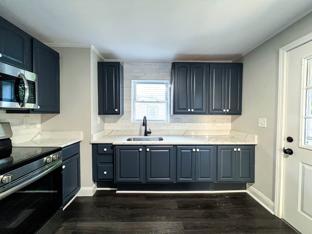 67 Waltham Street Maynard, MA 01754 - Photo 8 of 29 a bathroom with a sink and a mirror