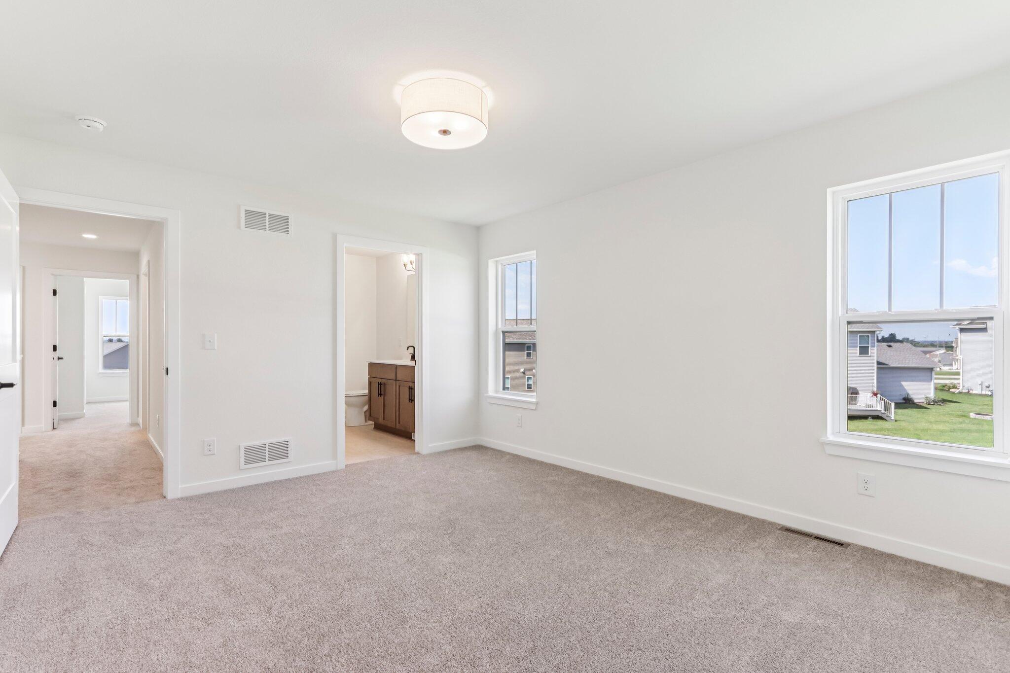 675 Mary Way Slinger, WI 53086 - Photo 17 of 30 675 Mary Way 17 Primary Bedroom