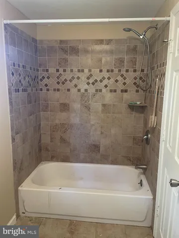 a bathroom with a shower and a bathtub