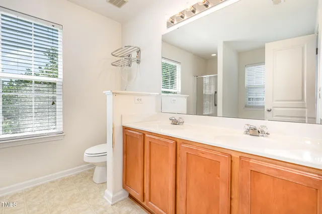 a white bath tub sitting next to a shower