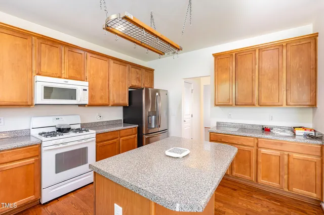a view of an empty room with a fireplace