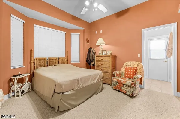 a bedroom with bed and window