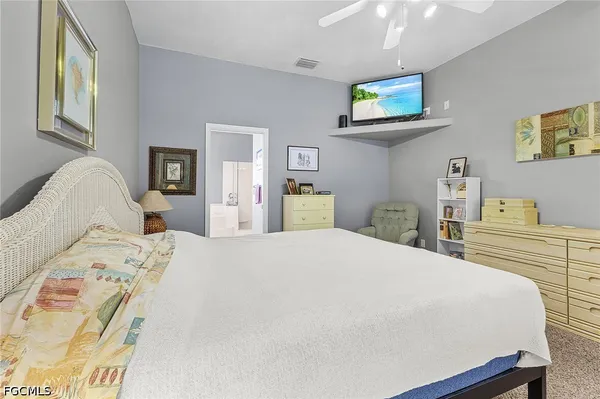 a bedroom with a bed and a cabinets