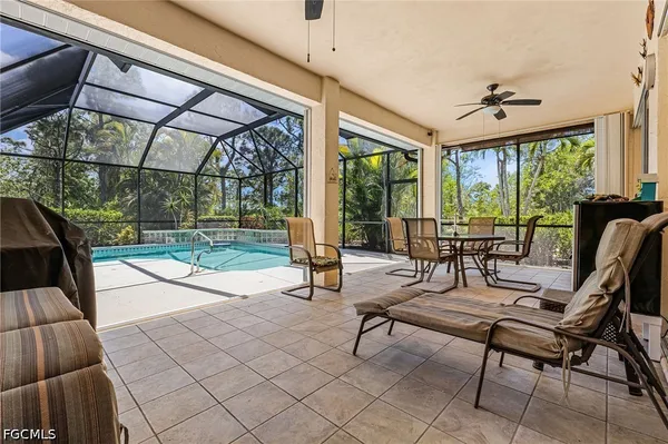 a building outdoor space with patio couches and glass door