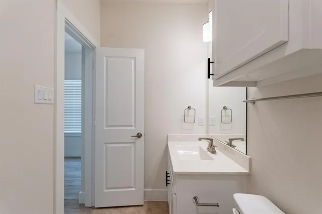 a kitchen with a refrigerator stove and cabinets