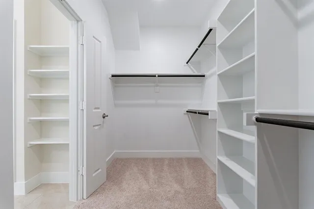 a white bath tub sitting next to a window