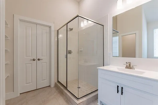 a bathroom with 2 sink and a mirror