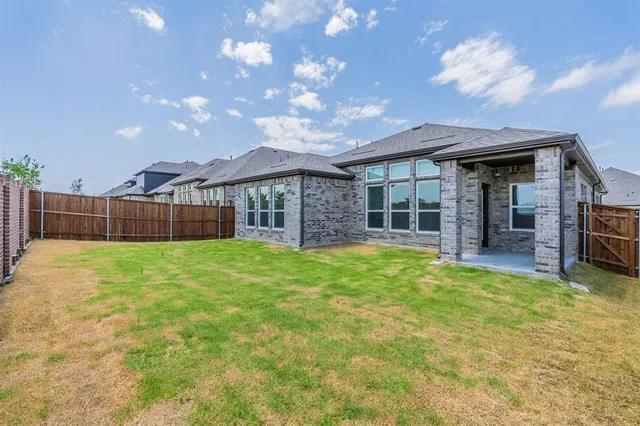 a view of a glass door with a back yard