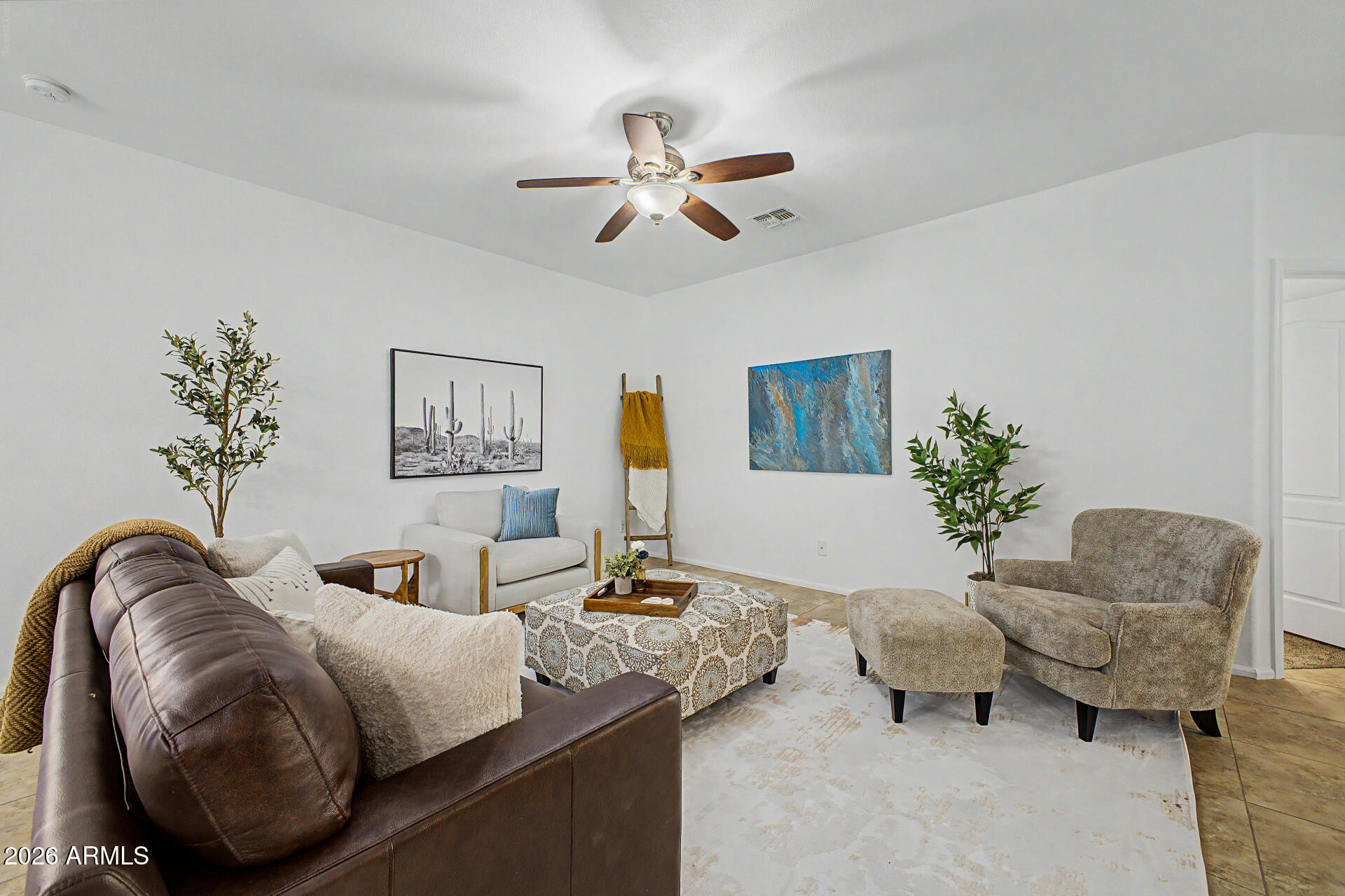4168 East Sandy Way Gilbert, AZ 85297 - Photo 7 of 47 a bedroom with furniture and a chair