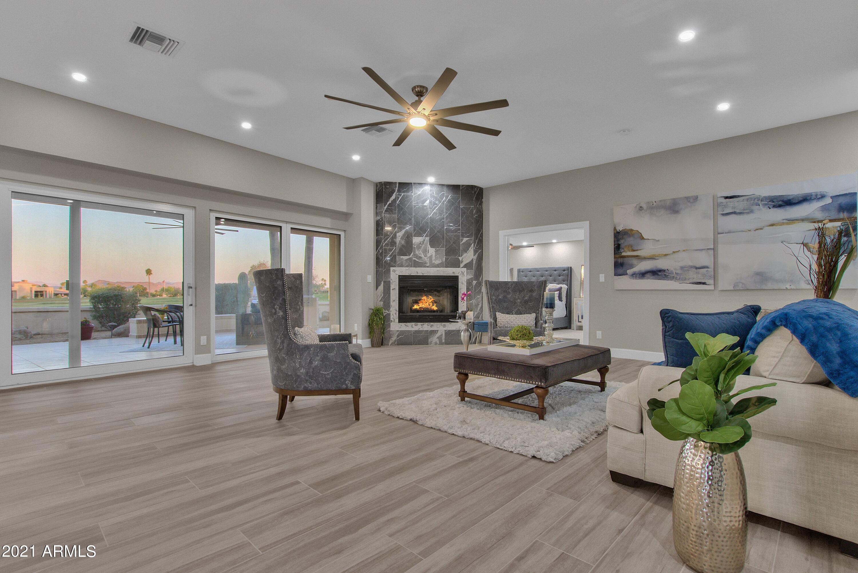 18624 East Parada Circle Rio Verde, AZ 85263 - Photo 8 of 76 FOCAL FIREPLACE W/ UPDATED SURROUND
