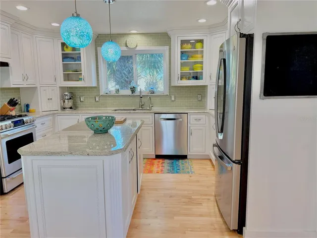 a view of a roof deck with table & chairs