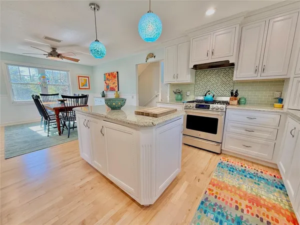 a view of kitchen with cabinets and wooden floor