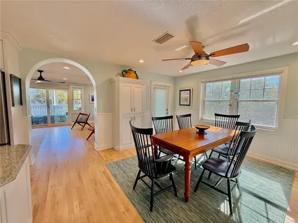 a view of a livingroom with furniture workspace and a window