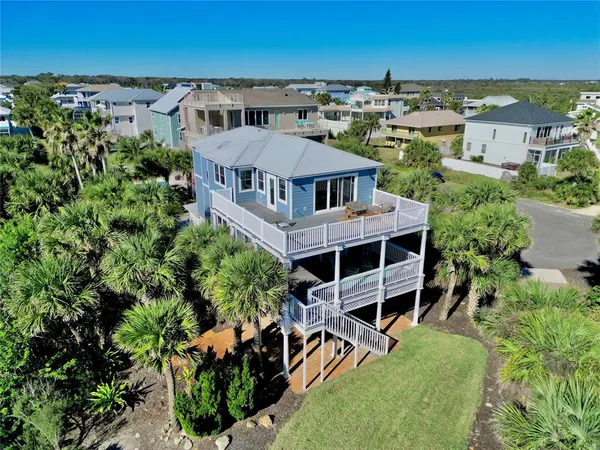 an aerial view of a house with a garden