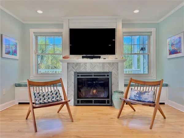a bedroom with a bed and a view of living room
