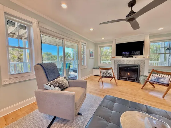 a bedroom with furniture and a large window