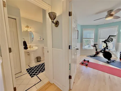 a room with pool table and windows