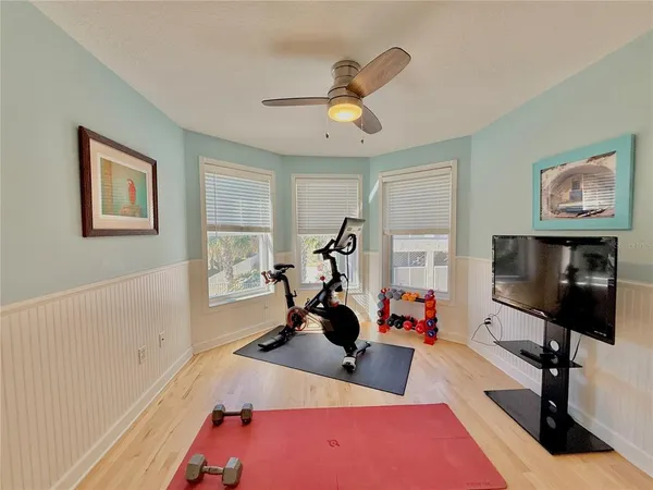 a view of room with wooden floor