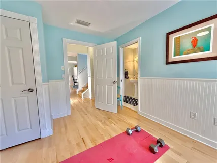 a living room with furniture and large windows