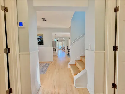 a bed room with a bed and a chandelier