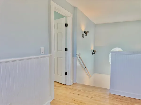 a bedroom with furniture and a flat screen tv