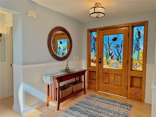 a kitchen with stainless steel appliances granite countertop a sink a stove and refrigerator