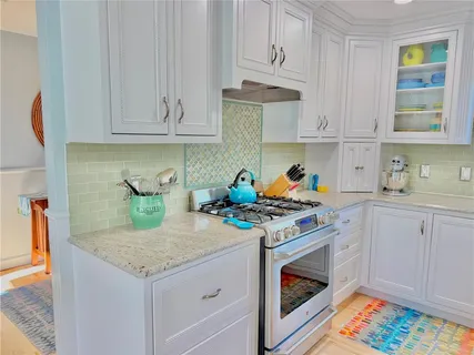 a kitchen with cabinets and appliances