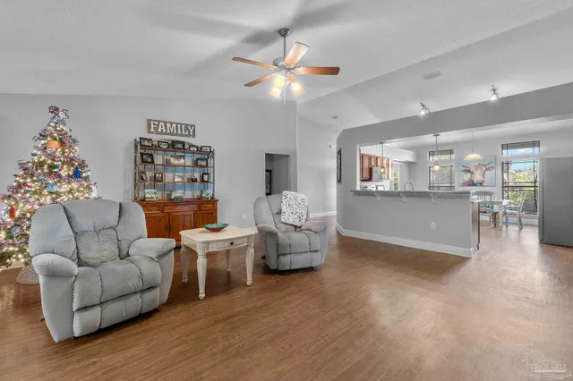 a view of a play room with furniture and a window