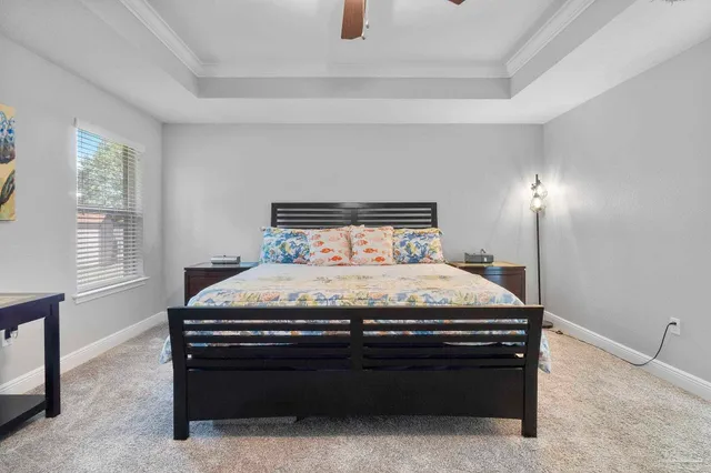 a bathroom with a granite countertop tub a sink and a mirror
