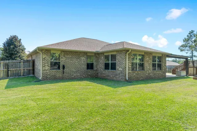 a house with swimming pool in front of it