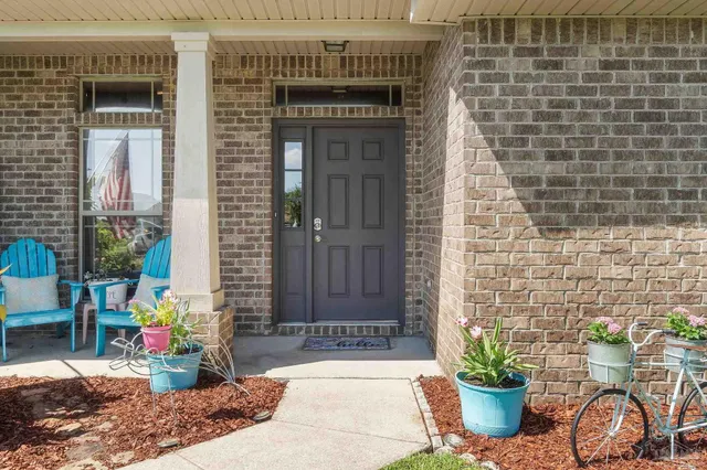 a front view of a house with outdoor seating